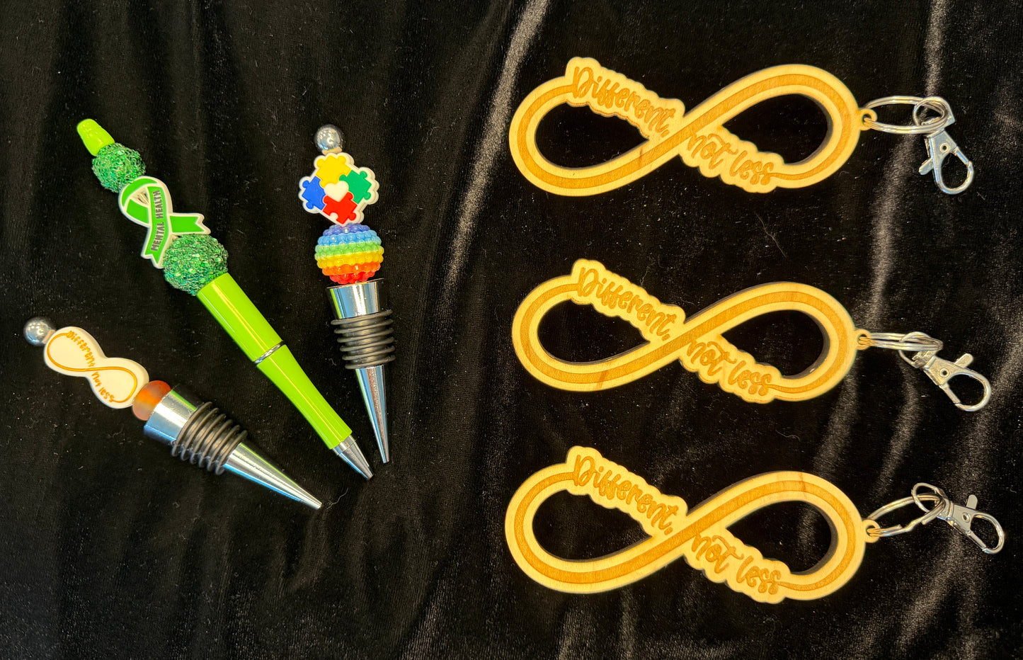 Cause Keychains, wine toppers and pens