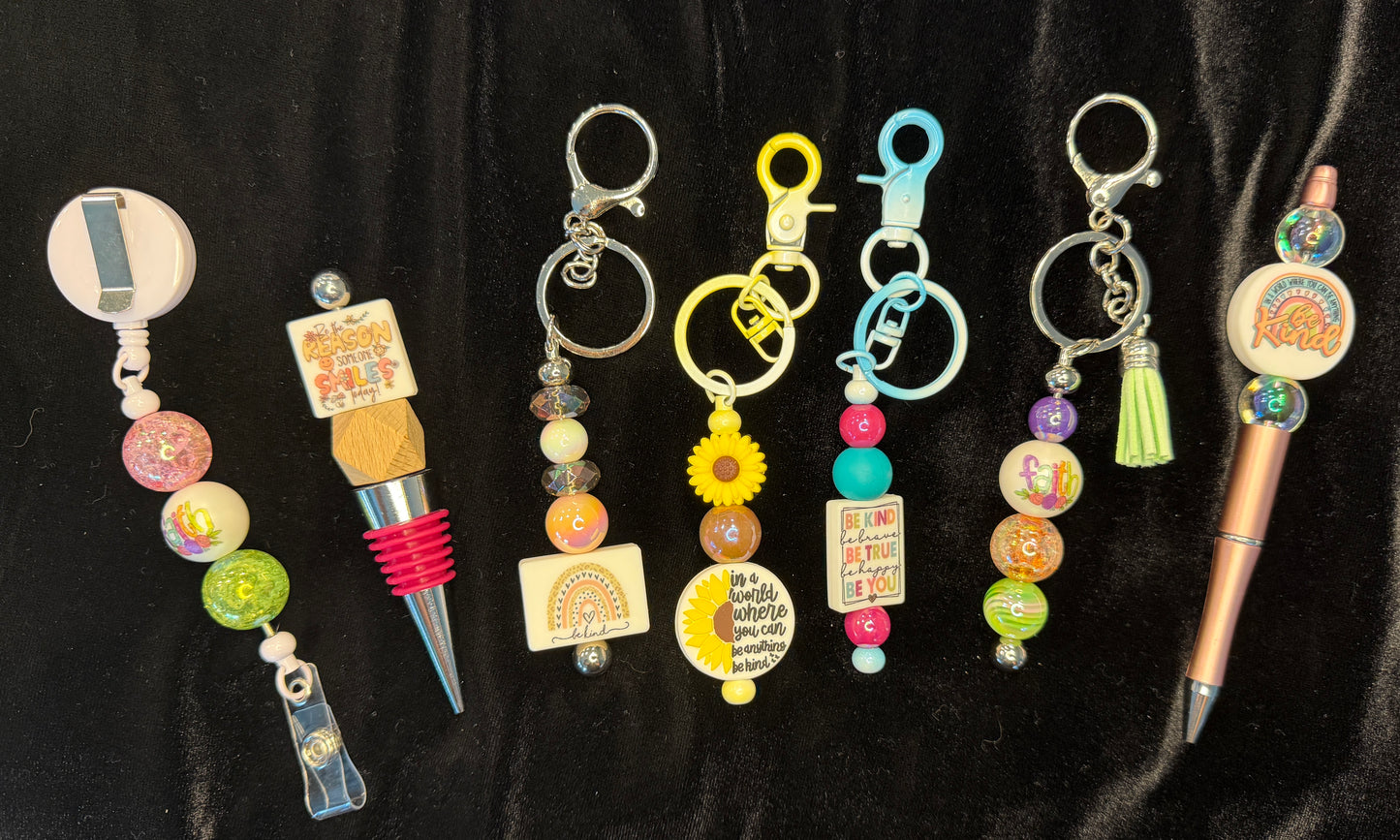 Kindness Pen, keychain, wine topper and badge reel