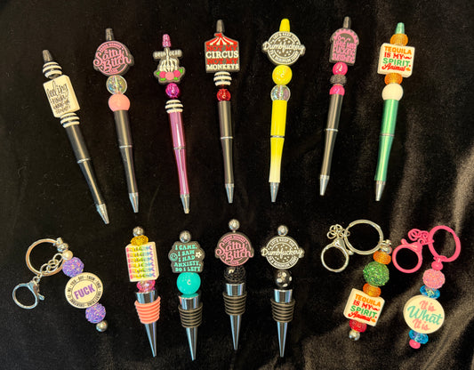 SASSY Pens, keychains and wine toppers